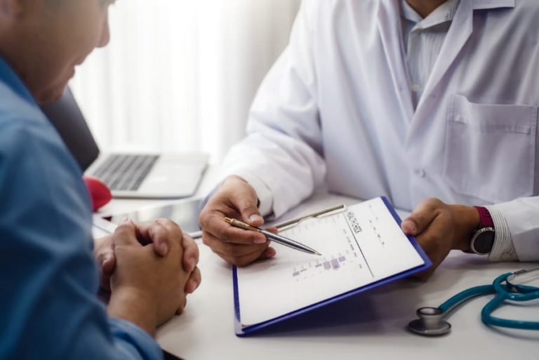 Physician reviewing test results with a patient