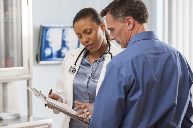 Doctor talking with patient