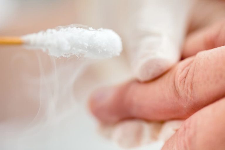 Cotton swab for applying cryotherapy to a patient’s hand