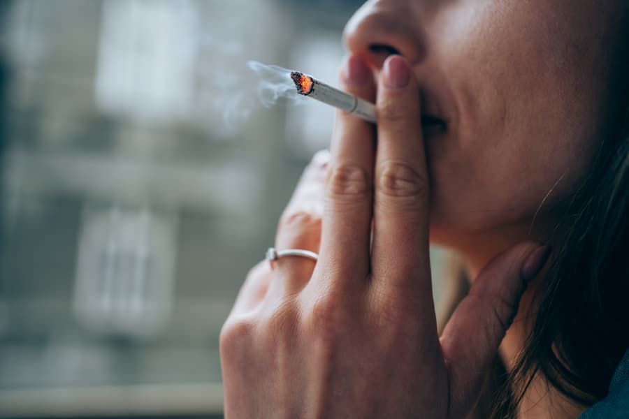 Closeup of individual smoking a cigarette