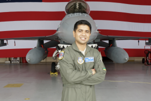 Dr. Kumar and an F-16 fighter jet.